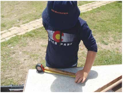 A child learning how to measure